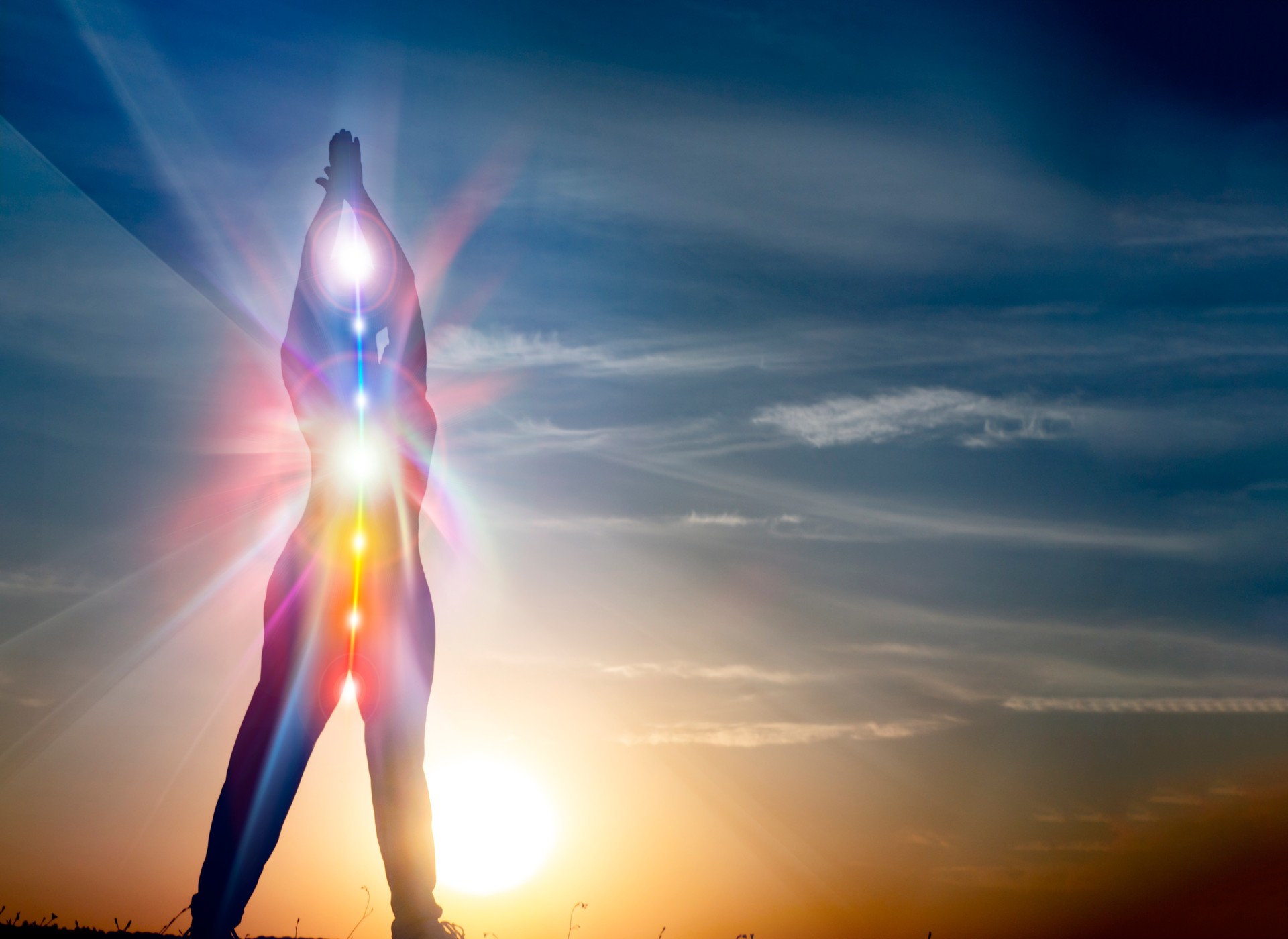 Silhouette of woman in yoga pose on beach sunset view, glowing s